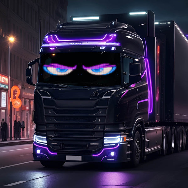 Custom black truck with LED lights and animated eyes, showcasing a unique car customization style at night.