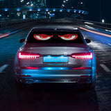 Car LED display showcasing Demon Eyes effect on rear window during night drive.