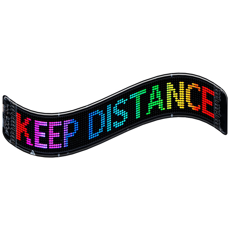 Colorful LED display showing 'KEEP DISTANCE' message for safety awareness in vehicles.