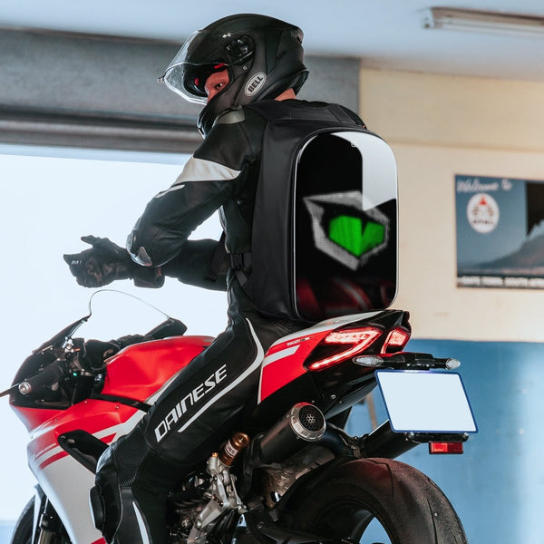Gelrova LED Motorcycle Backpack - Rampage Series, customizable display, worn by rider on sport bike.