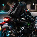 Gelrova LED Motorcycle Backpack - Evolution Series 19" in use by a rider on a motorcycle at night.