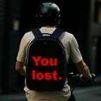 Gelrova LuminaPack X1 LED Motorcycle Backpack, 16.6" with LED display saying 'You lost'.