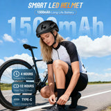 Female cyclist wearing a rechargeable programmable LED bike helmet with a 1500mAh battery for 12 hours of riding.