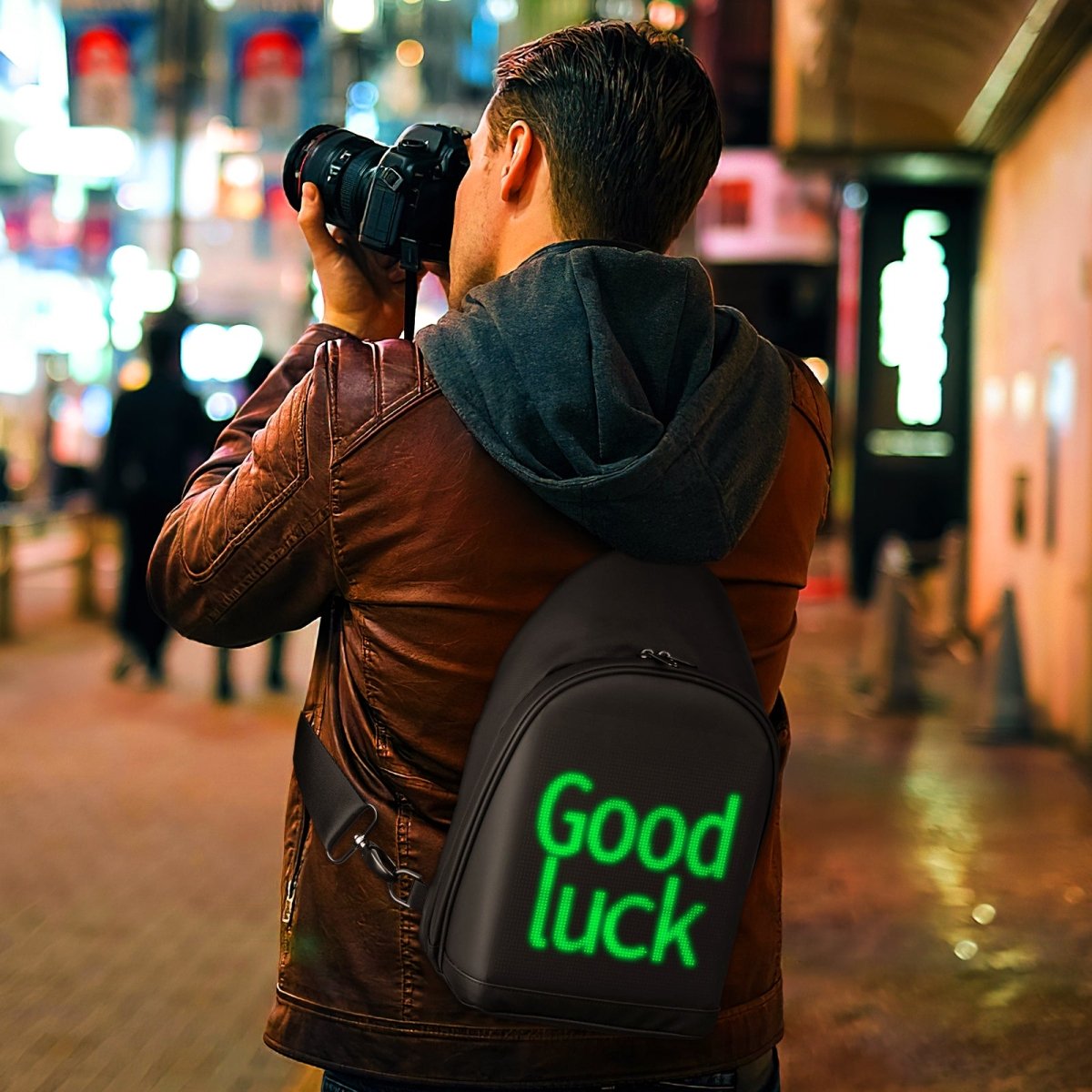 A man carrying the LED Crossbody Bag – City Series
